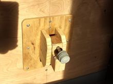 Spare tire holder; what can I say, I'm cheap.  Saved $35 with some wood scraps and a bolt/nut.  Pretty darned strong.