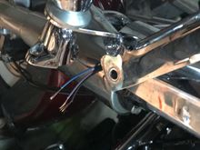 After pulling the chrome headlight surround, I was able to expose enough wire to splice.