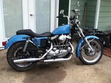 This is my 80 Sportster,  Historical list of what I've done to it to date:

1. Just got finished rewiring the bike, polished it up a bit.  80's wiring harness connectors starting to fall apart so I cut the wires to the connectors and soldered the wires together.
2. I just ordered an oil cooler.  Don't know if I needed it but I figured it's air cooled and I do a lot of stop &amp; go traffic.
3. Did my first oil change 70W.
4. Replaced stretched chain.
5. Replaced rear brake gaskets, bolts.  Pads were still like new.
6. Took out tach gear and plugged it, tachometer is gone.
7. Installed waterproof digital votage meter so I can keep an eye on the battery, charging system.  

Future ideas:
I was going to keep it original!
- I don't like the baby blue, that's gotta go.  Saw a bike on here bright yellow and another orange.  A friend had an idea of using those two color schemes with a newer paint.  Kind of like the paint that looks black in the shade but blue in the sunlight.  Same idea
- Don't like the looks of the seat, that's going
- I prefer the soft tail style fender. Fender struts are missing.
- Not sure if you can see the gay ass turn signals, those are being switched out with Adjure's Beacon 2 turn signals.
- I'm short so I'll be lowering it a bit, just not sure on which shocks to replace the OE shocks.