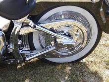Left of rear wheel