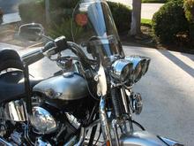 HD chrome headlight and turn signal bezels.  New windshield plexiglass from 7jurock.com, 3 inches shorter than stock.