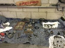 you can see campmate all cleaned up, when I got there, oil pump looked new, had high pressure grease, and oil in parts, had a rollout gauge to measure rollout, SO GLSAD I GAVE IT TO A PROFESSIONAL, AND NOT DO, he's measuring the relief spring, doing a lot more than I would of, the plate and old cams look new, so they will be for sale for sure......3k miles is nothing, as first 1900 most likely never went over 60mph for sure!!!!