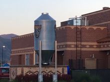 The Straptank Logo, visible on the side of this silo, includes a Harley engine.