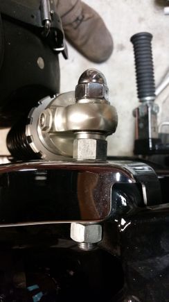 Here's the shock installed on the modified upper mount. This moved the shock inboard about 5/16" and I can now use the stock acorn nut with just a washer, no spacer.