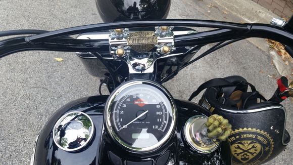 The brass emblem easily bent to conform to the shape of the fork clamp