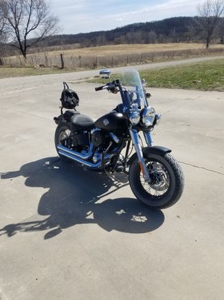 cut windshield to fit with 10 inch bars and not have to relocate turn signals. buffeting made it feel like my helmet was in a paintshaker