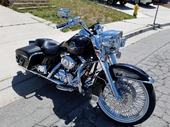 08 Road King Classic  with air ride, 21" front wheel, hooded front light trim rings, front L.E.D headlight and passing lamps. Some recent changes.