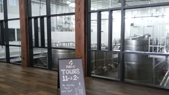 Tour schedule and in the background the wine fermenting for future vintages.