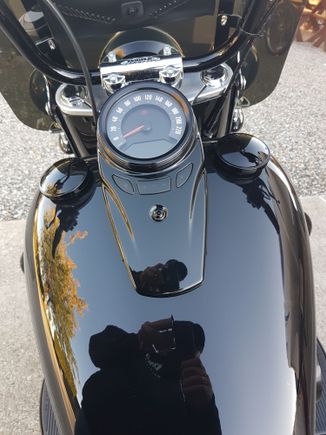 Looks like the same construction as the stock one
Mine was a rattle cap so upgraded to the black on warranty,  even money. I had to buy the left fake cap. And a little touch up paint on the console bolt. I like it.