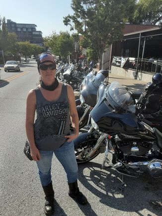 My wife standing in front of a row of bikes on Dickson . Quite a few bikes already here.