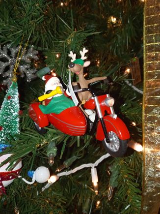 This one is almost 30 years old from Hallmark. If you unplug a christmas light and plug it into the strand the headlight lights up