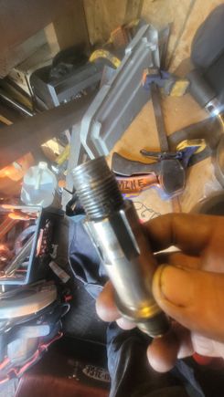 Threads were worn halfway down. Replaced with a new shaft. 