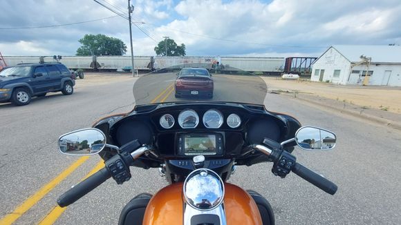 On a 2 lane road, somewhere in Iowa, waiting on a train. 