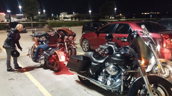 New friends and girlfriend dry running a bike.