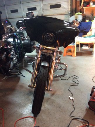 I used fork mount brackets, bought off eBay. Cheap light bar eBay as well