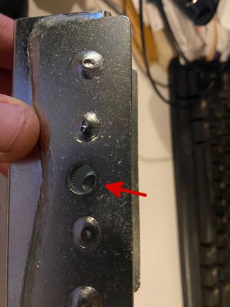 The threaded rod/handle does not align with the hole.