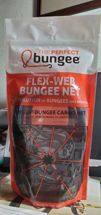 Picked this up at Daytona Bike week.  I plan to use it for my soft bag that goes on top of my TP luggage rack. I can see it holding your helmet securley, just get the correct size.