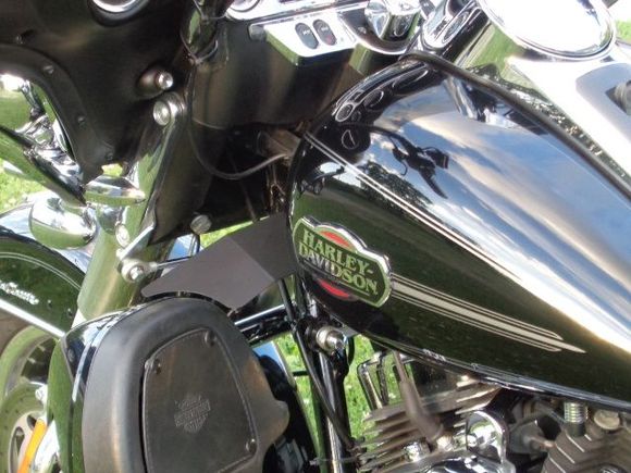 Air deflectors and raised fuel tank to force air on motor rather than up in face.