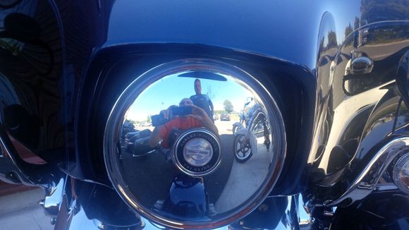 Close up of chrome plate in place of a glass fixture.