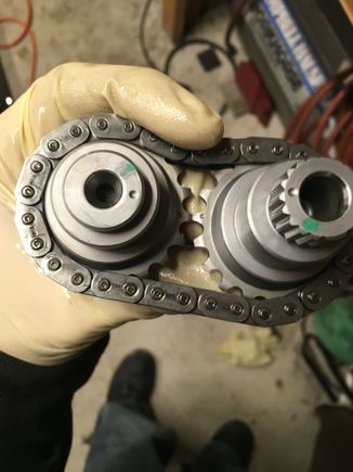 The new cams have timing marks on the ends and the gears. Very nice. Slip em on the chain and line up the timing marks. Then install into the cam plate with spacers, and the snap ring. Check the SM for this as you have to check clearance of the snap ring ears with a feeler gage