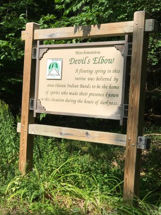 This sign is on a hairpin corner where there is ravine caused by a spring