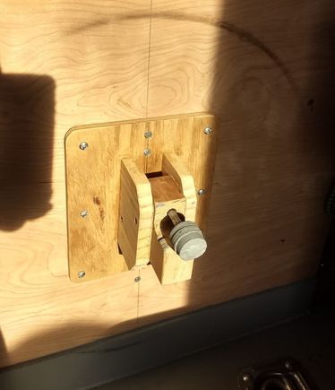 Spare tire holder; what can I say, I'm cheap.  Saved $35 with some wood scraps and a bolt/nut.  Pretty darned strong.