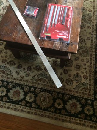 1/8 aluminum piece, didn't have all the cutting tools so had to buy files and metal blades..