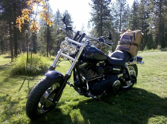 Now this is a prime case of "You might be a redneck if" you have ever strapped a 50lb bag of redneck camo on the back of your Harley, i.e. Apple corn..
