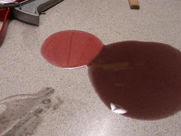 Two year old for oil next to fresh fluid from the bottle it came out of.  2009-Mar