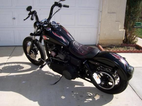 Current pics. Powder coated gloss black front signals, signal clamps and dash. Pinstriped A/C and horn covers. C&amp;C lopro solo seat with red stitched flames.