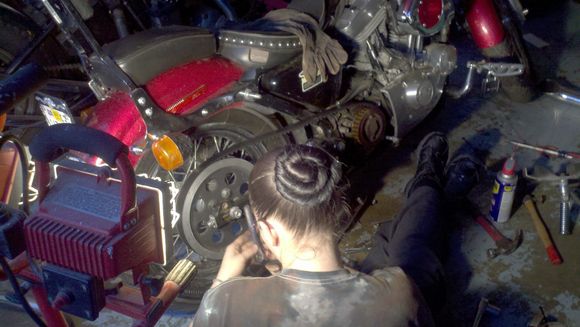 Rose replacing the drive belt on her 1998 Sporty