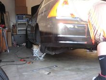 Ghetto style installation of the Skunk 2 coilovers.
notice the books we put under the car just in case
the stock jacks from my car and my friends broke
while installing them.