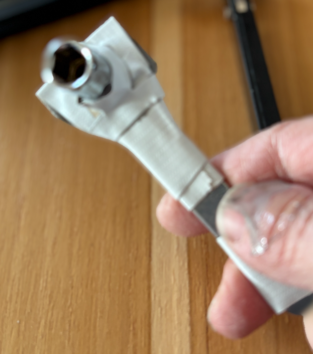 I taped an 8mm socket to a flat bar to get to the screws on the passenger actuator. This got them started.