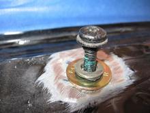 Old nut with steel washer ready to weld