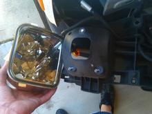 Just remove three screws on the back of the headlight housing to replace the turn signal.