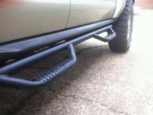NFAB Steps inside of the - installed way too low to be useful - chrome OEM's.