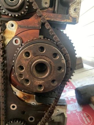 With the bearing brace/caps not installed (a mistake on my end), there is still too much tension on this chain.  Take one hand (not shown due to working the camera) and try to pull the chain off the crankshaft.....