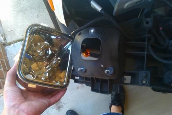 Just remove three screws on the back of the headlight housing to replace the turn signal.