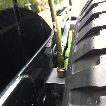 9' military antenna with custom painted bracket ($2 from home depot)