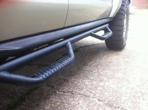 NFAB Steps inside of the - installed way too low to be useful - chrome OEM's.