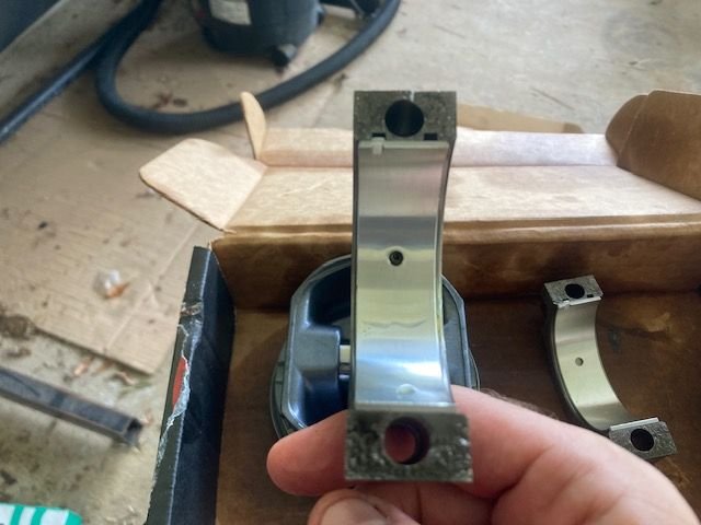 Ensure the connecting rod bearing lines up with the small oil control hole.  