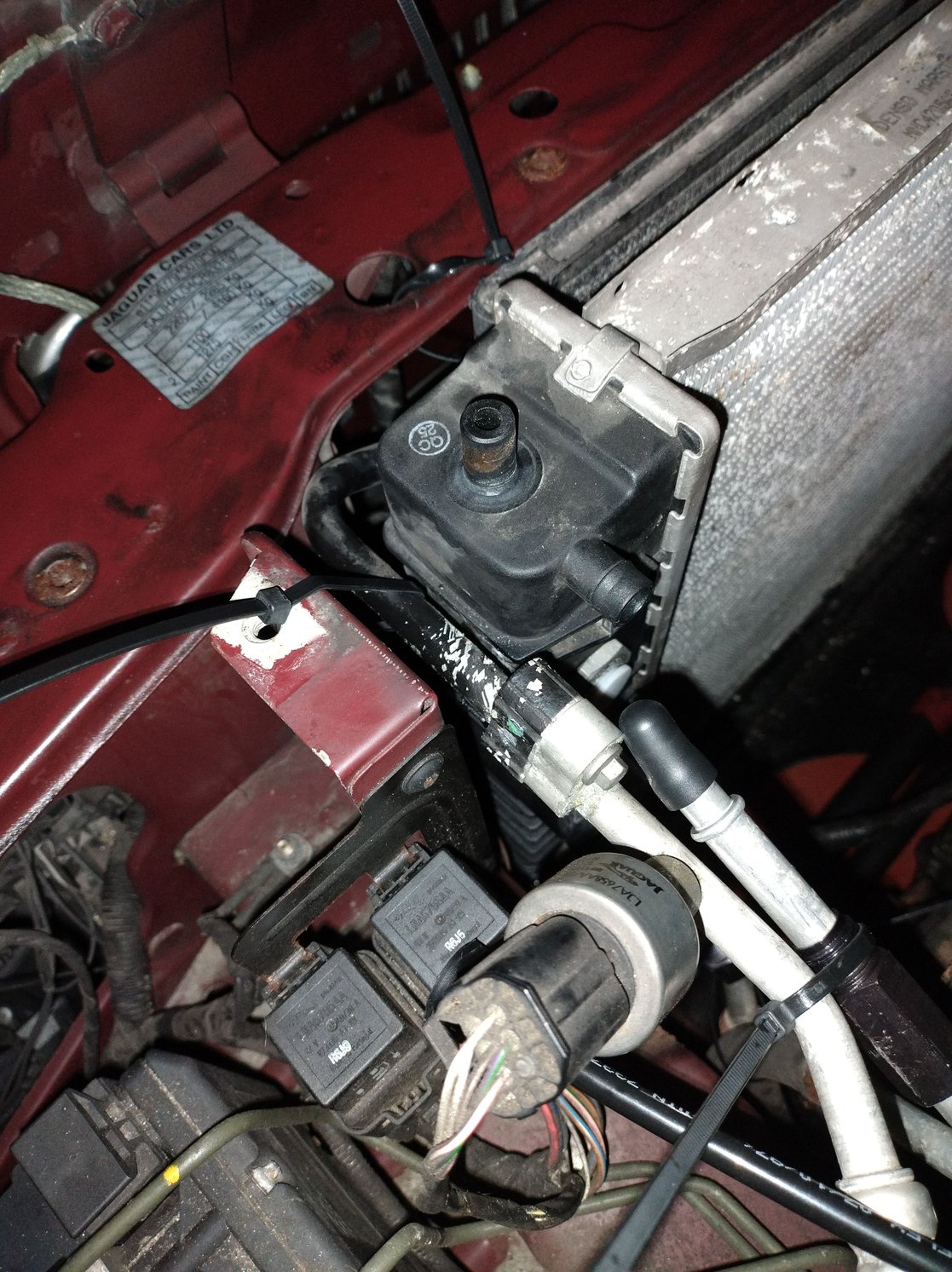 Push the AC line driver side as much to the side as you can. You can also see the transmission line plugged.