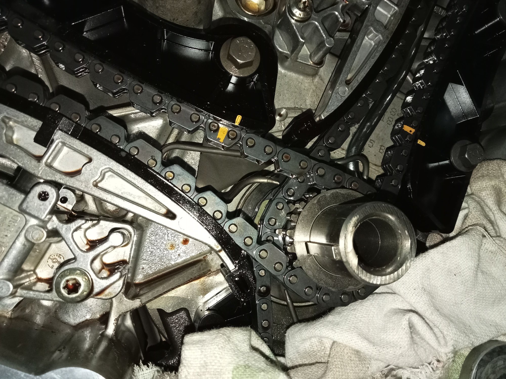 Original Right tensioner. The tensioner has not moved far so I'm confident the chain has lots of life still. The plunger has worn a mm or two into the rear of the blade.