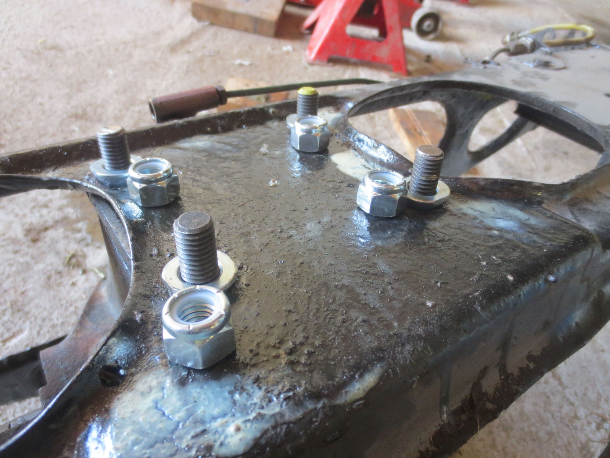 Tapered washers to fit into the tapered hole in the cage