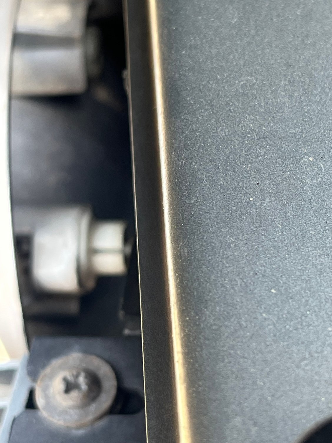 On both assemblies I sprayed silicone lubricant into the gap visible here on the ball/socket plastic parts I could see and reach. 