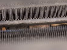 Not terribly clear, but this is a shot of the leaves on the radiator seen through the narrow slot between the condenser and the oil cooler (I think those are what they are).