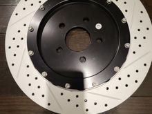 This is the rear rotors larger and lighter comes with braket for stock calipers...