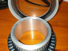 Needle roller thrust bearing with spring spacer/debris shield.