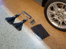 Safe Jack adapter was fabricated to fit car.  Plates stop the SafeJacks digging into epoxy floor.
