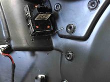 View of the installed switch from behind the door panel